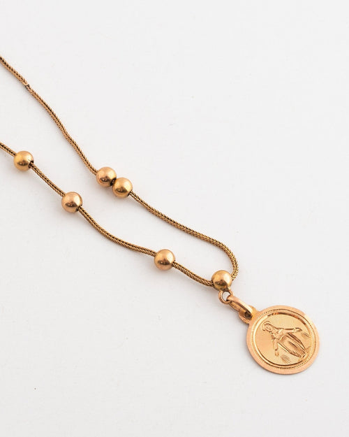 Collier et médaille en or jaune